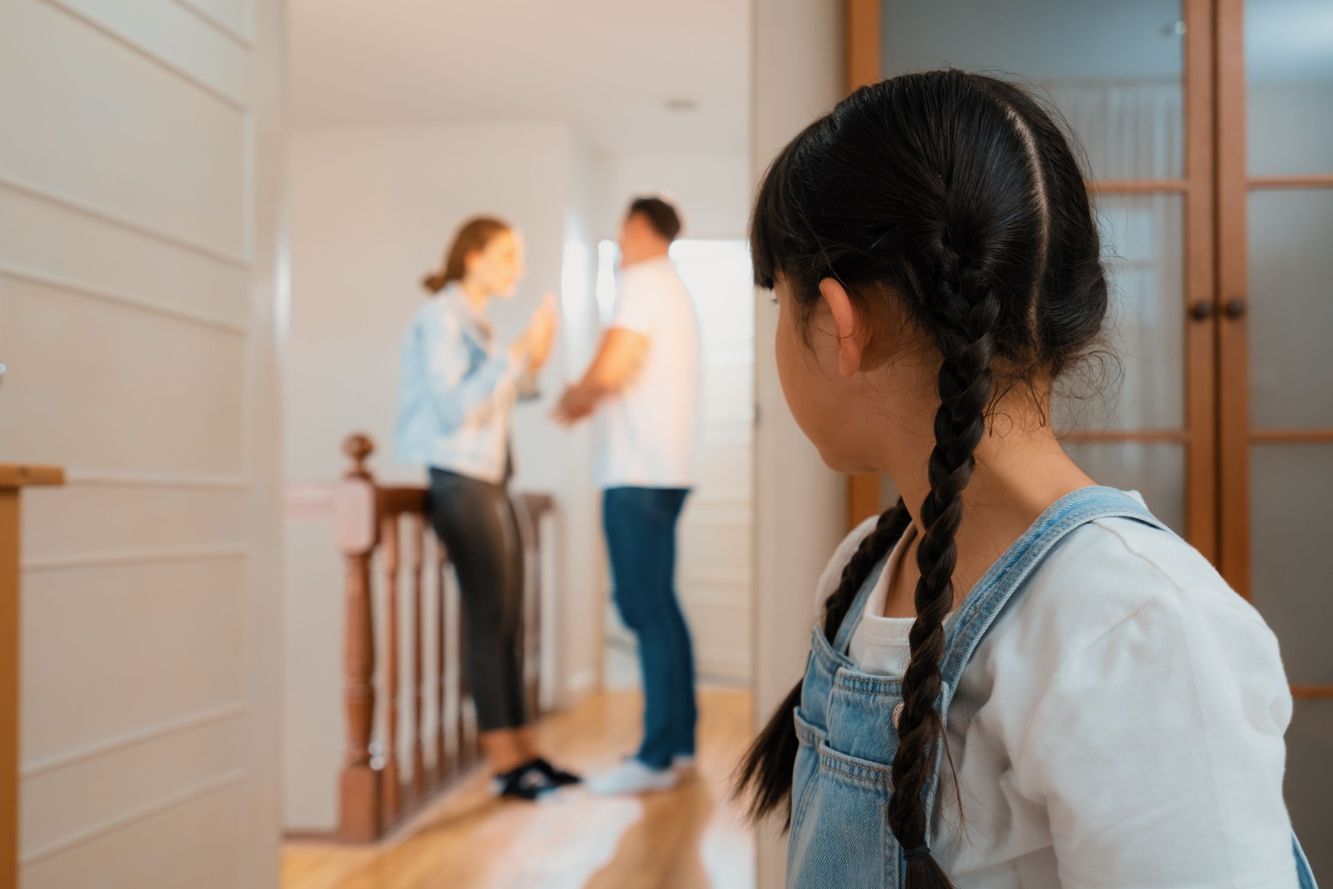 Stressed and unhappy young girl hide from domestic violence at home. Synchronos Stressed and unhappy young girl hide from domestic violence at home. Synchronos